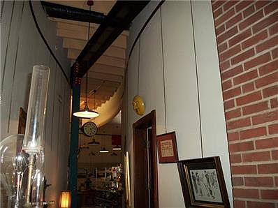 Curved hallways, exposed steel beams, 14 ft ceilings, picture hanging system