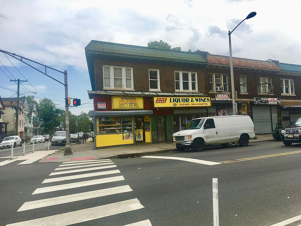 The property. The apartment windows are on the right, above the Liquor Store.