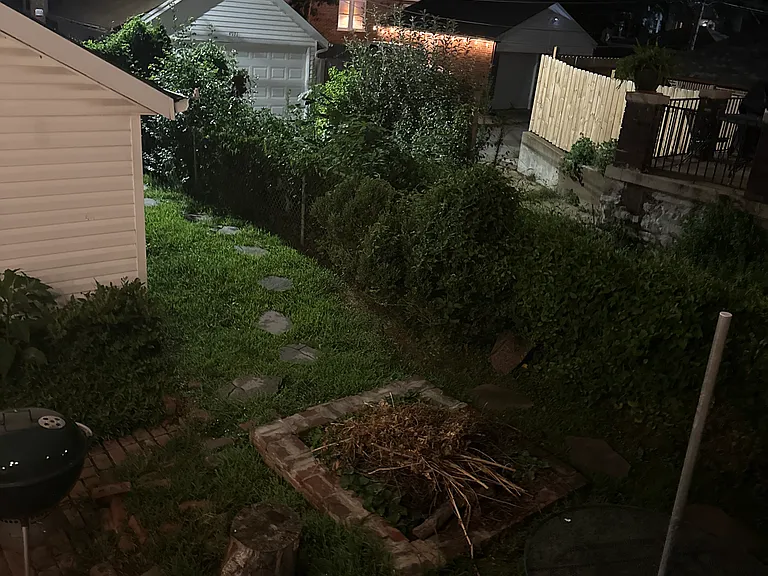 firepit, patio table, and grill. ready for a campfire.
