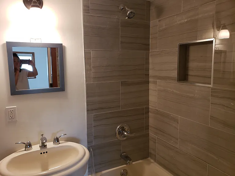 Newly tiled shower/bathtub area.