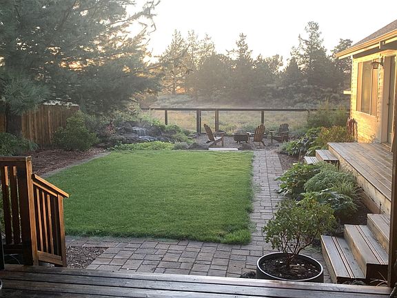 View of backyard with gurgling waterfeature.