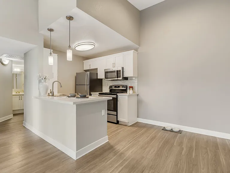 Open-concept layout connects the kitchen, dining, and living areasperfect for hosting guests and enjoying seamless everyday living at The Summit at Chino Hills.