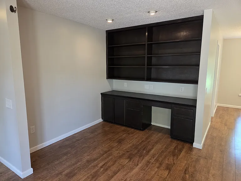 Built in office space set off to the side of the living room