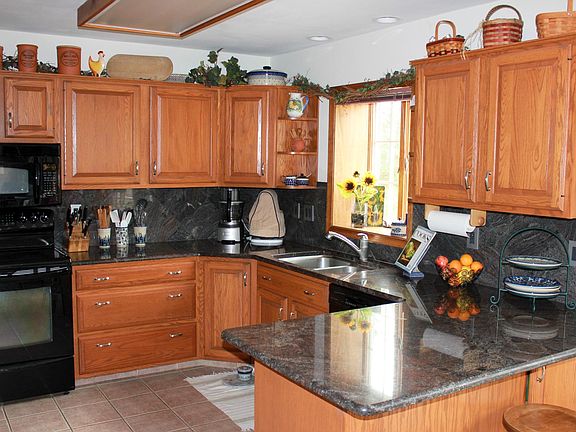 Kitchen with granite counters.