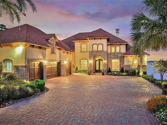 Guests are greeted with well lit grand entry, slate covered front porch, and beautiful landscaping.