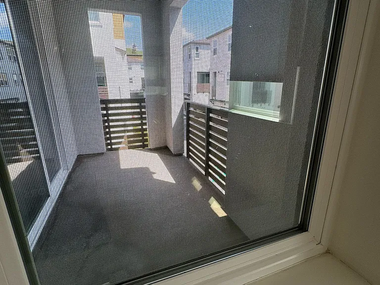 Balcony next to kitchen and living room