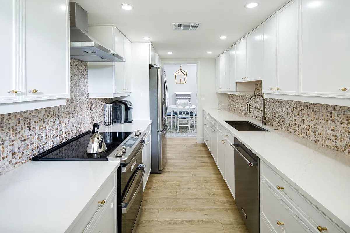 the 16 foot long fully stocked galley kitchen - 3420 Gulf Shore Blvd N #14