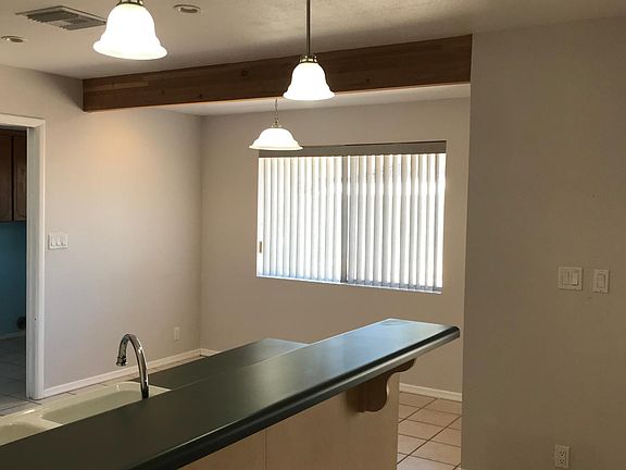 Breakfast nook in background. Kitchen to left.