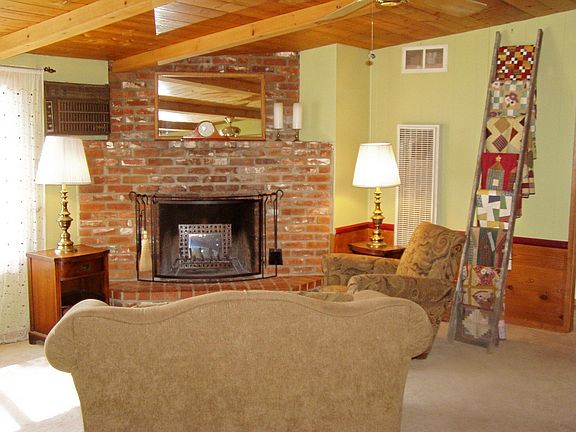 Cozy Livingroom with brick fireplace.