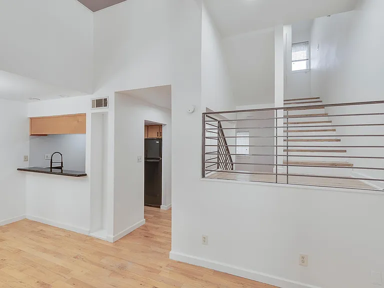 Living Space Facing Kitchen and Entrance