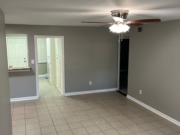 Living Room facing kitchen hall way to bedrooms