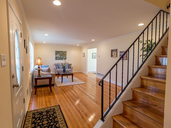 Spacious living room with gorgeous hardwoods!