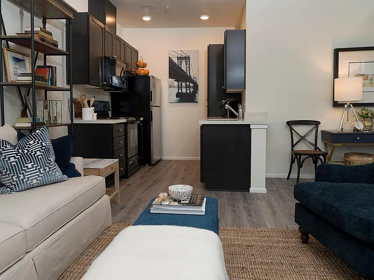 Living Room & Kitchen in a 2 Bedroom Apartment at 5100 Summit Apartments
