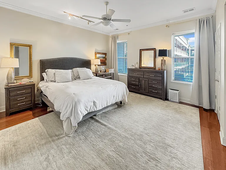 Spacious master bedroom. Large walk-in closet and 2nd closet located in the room. Windows overlook the front balcony. Quiet room with plenty of lighting