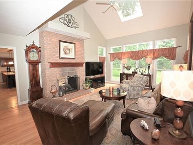 Family room w/wall of windows and skylight