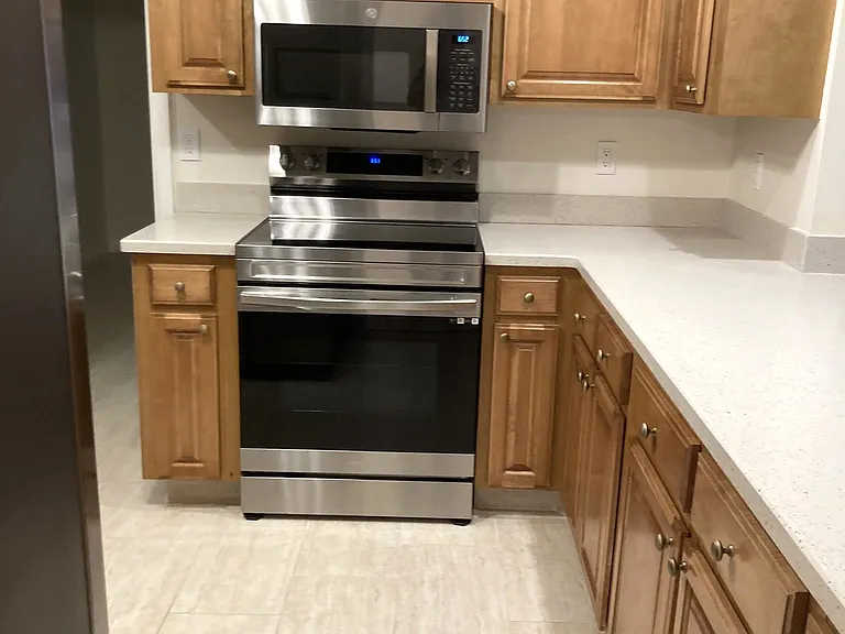 Spacious kitchen with lots of cabinets for storage