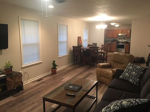 Does not come furnished. Living room/dining room combination looking into kitchen from front door