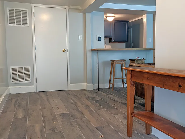 View from front door. Storage closet with washer and dryer straight ahead.