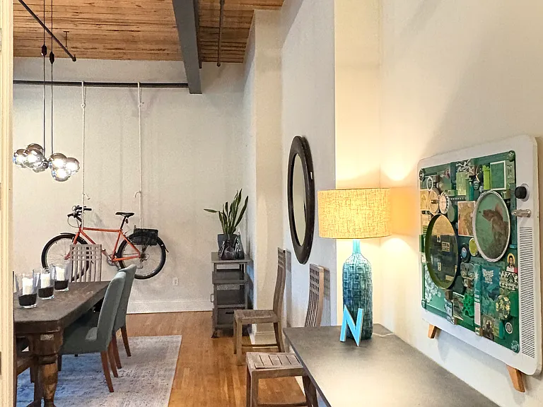 Large foyer counter is set on iron urns. Original commissioned art by Michael Sweere