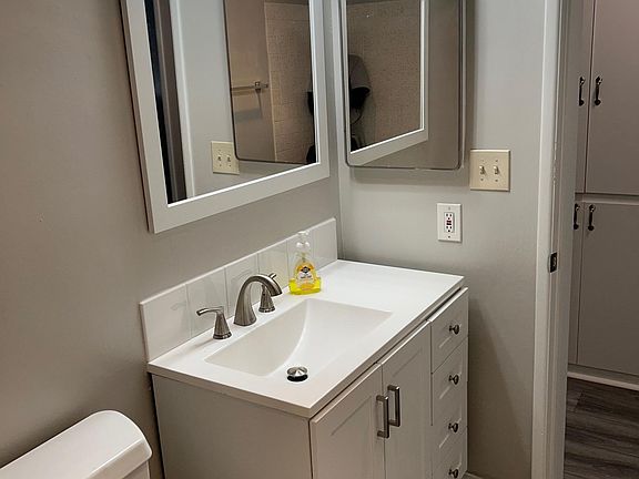 main bathroom with new light, new vanity and mirror