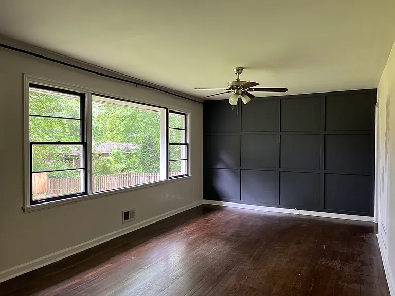 Living Room with custom feature wall and large picture window