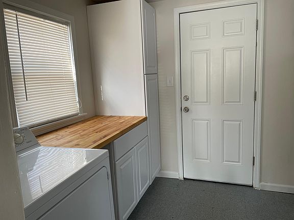 Laundry room with folding counter and extra storage