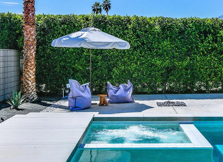 Spa (new teak/white cushion seating near fire pit not yet featured in photo)