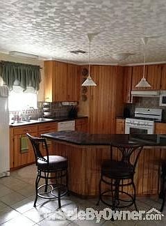 Granite Countertops ,Tile Backsplash, 3 compartment stainless sink