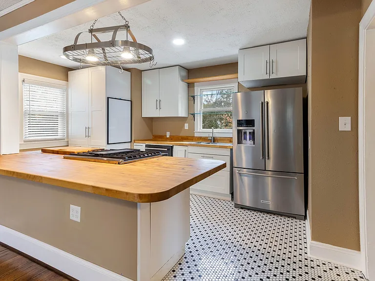 stainless Kitchen Aid Appliances and Penny Tile floor at 907 W Wendover ave