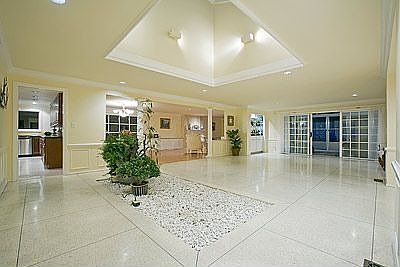 Commanding entry opens to a great room with an atrium & skylight