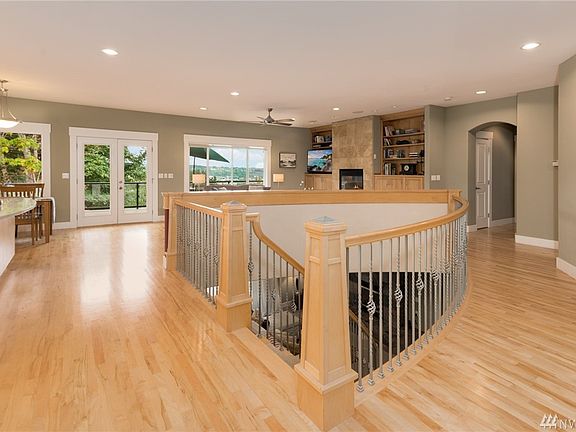 Open curved stairway with elegant balusters.  Hardwood floors throughout much of the main level.