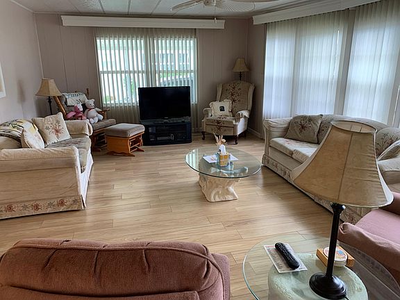 living room area with couch that has pull out bed (lazy boy furniture)