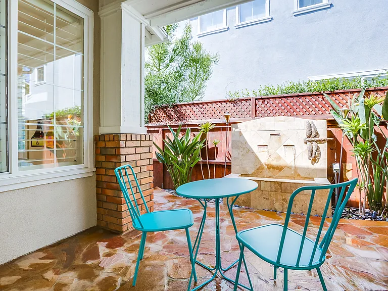 Have your morning coffee on your private side patio complete with waterfall