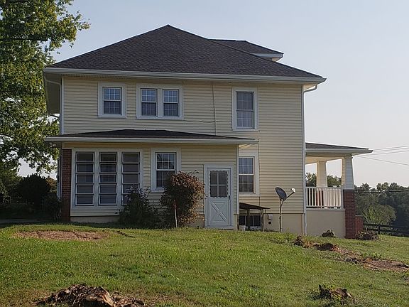 The little sun room acts as a mud room and enters into the kitchen.