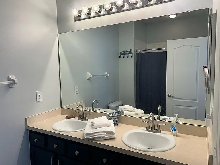large master bathroom with double sinks, soaker tub and shower