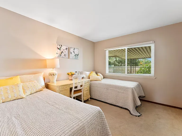 Bedroom 1-This bedroom can accomodate twin beds (or Queen bed) and it has a window overlooking the patio and garden. It has the closet with sliding mirrors.