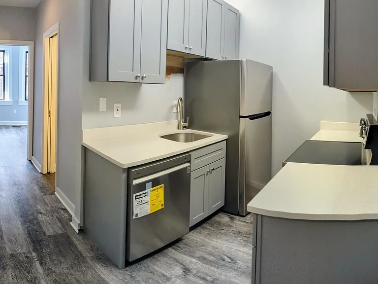 Kitchen and hallway to bathroom/bedroom