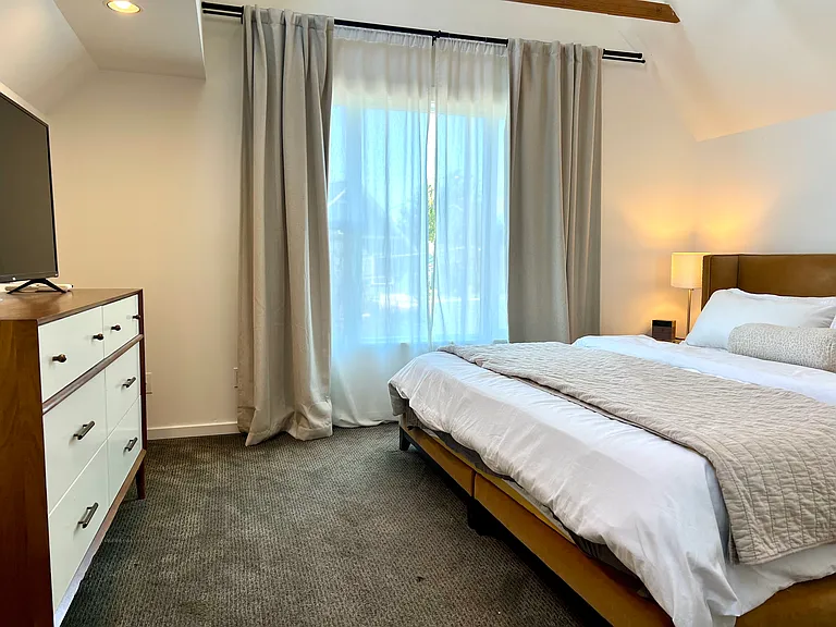 Ascend to the primary with large picture window, open loft feel with exposed beams and 4 sky lights for additional lighting. Air conditioning.