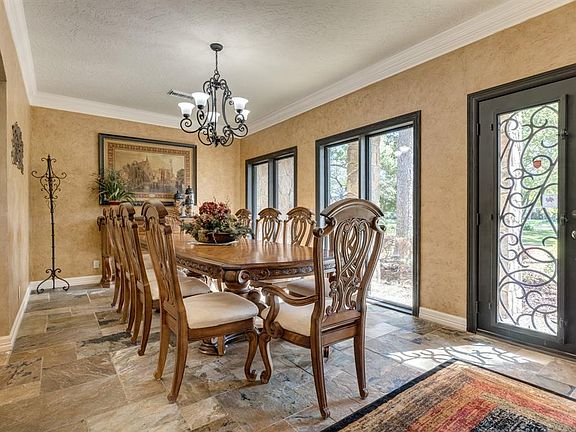 Dining with slate floors, double crown molding and lots of natural light