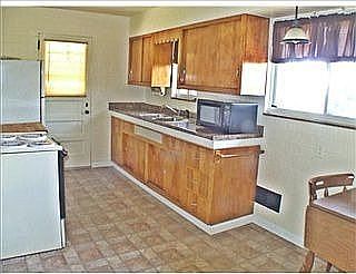 The kitchen features a new counter and Traffic Master Floor