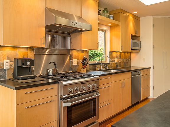 Updated Kitchen with Gas Range and Stainless Steel Appliances.