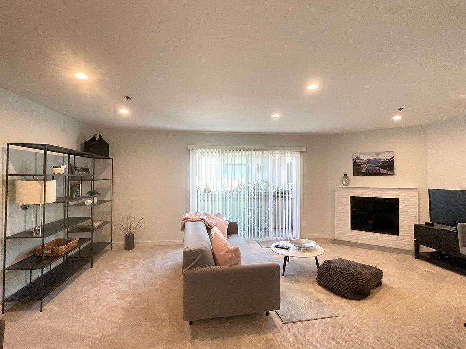 Expansive living area with furniture from Room & Board, Crate & Barrel and West Elm.