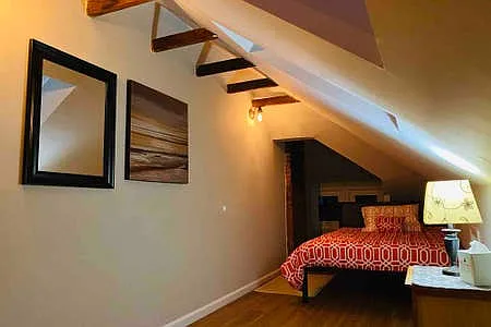 2 Full Beds, skylights & quaint sitting area. Upper level has it's own mini-split unit to control AC/heat