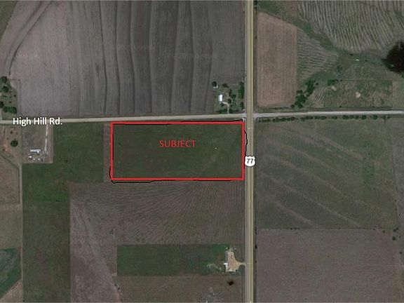 PHOTO SHOWING THE SUBJECT PROPERTY AT THE CORNER OF US 77 AND HIGH HILL RD.