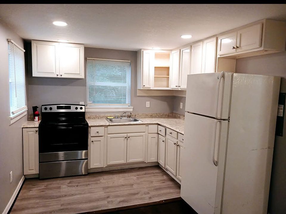 Bright open kitchen with newer appliances.