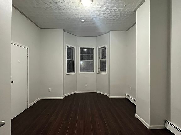 Bedroom #1 - High ceiling, new flooring, freshly repainted.