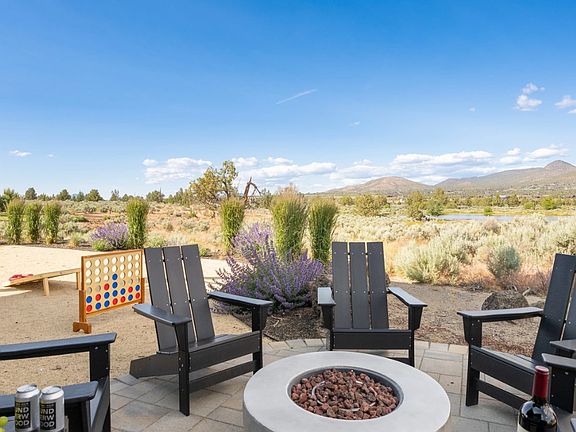 Fire pit and adirondak chairs to enjoy the back yard