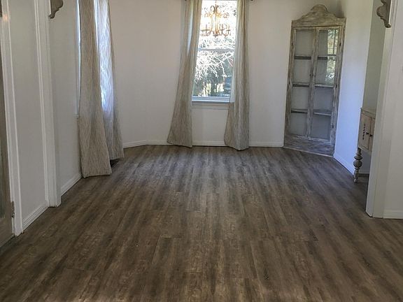 Large living room and dining room combination with lots of big windows