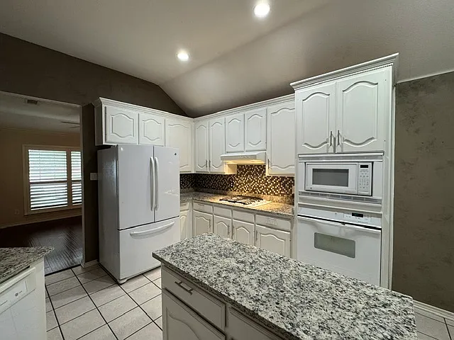 Kitchen with Gas Cooktop and French Door Fridge