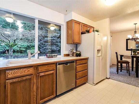 View from Kitchen looking towards Dining Room.  Some Stainless Appliances and Fridge Included!